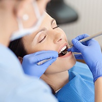 Relaxed woman receiging dental treatment